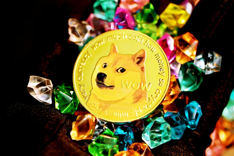 a gold colored doge on top of colorful gems