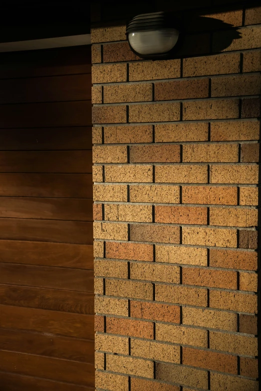 brick wall with wood paneling next to wooden door