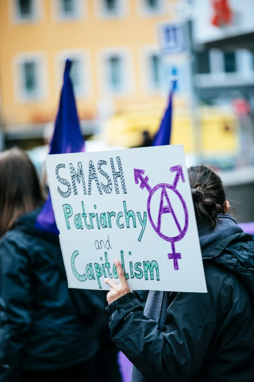 people with signs protesting against racism at a protest