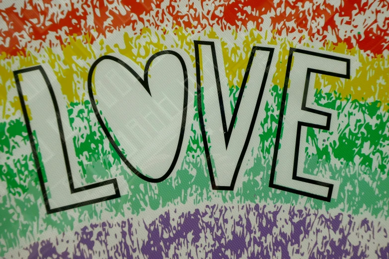 the word love on top of a background with an colors of different colors