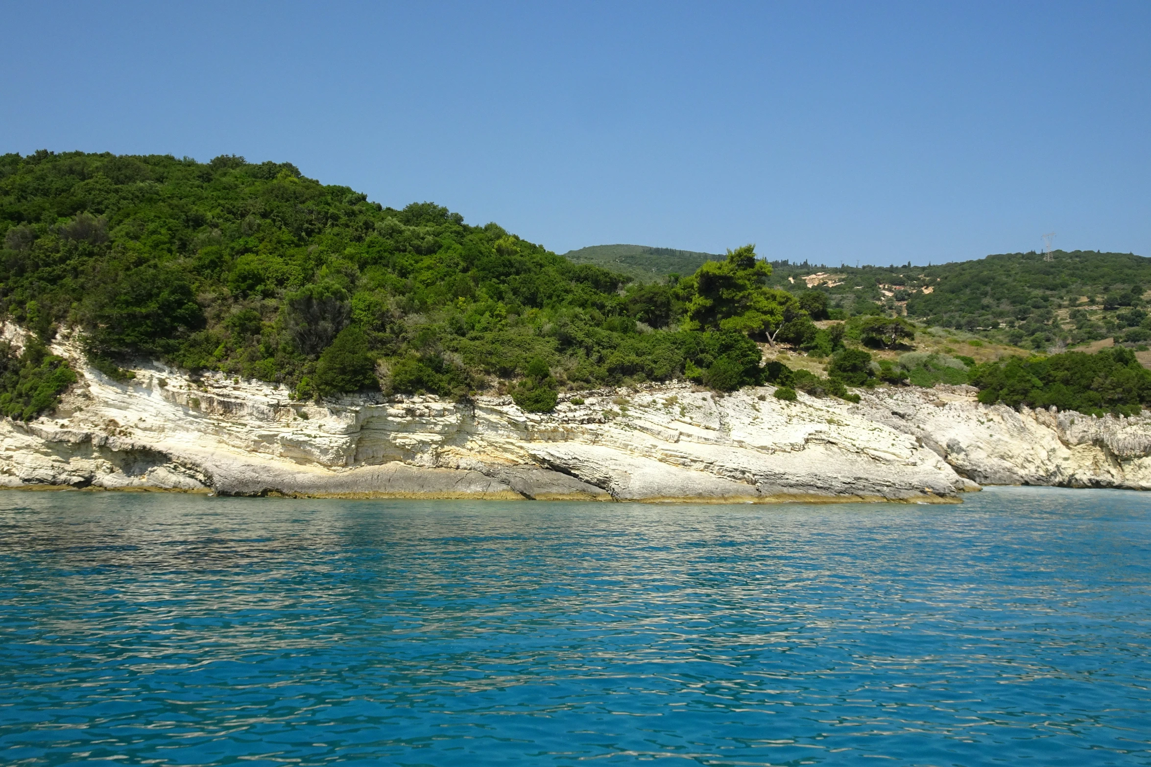 a boat traveling along a narrow body of water