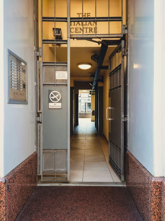 a walk way with doors open to the other side