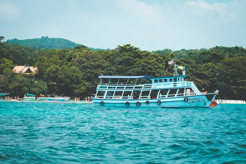 boat on the water near land with houses