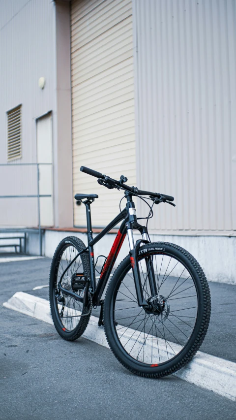 a bicycle sitting in front of a storage building