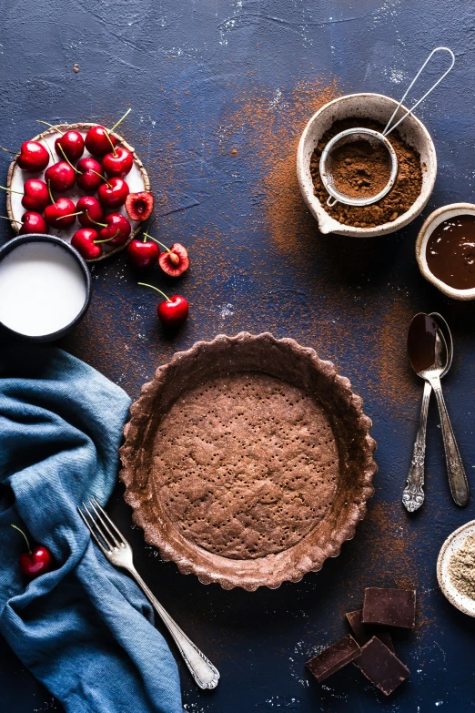 an array of dessert items, such as ding, cherries, chocolate