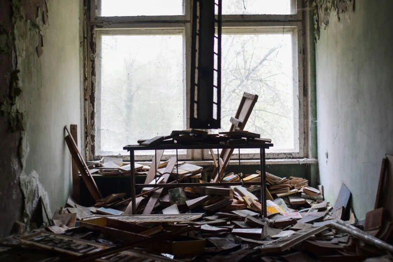 an old house has broken windows and debris all over it