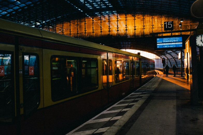 a train passing through an outdoor tunnel at night