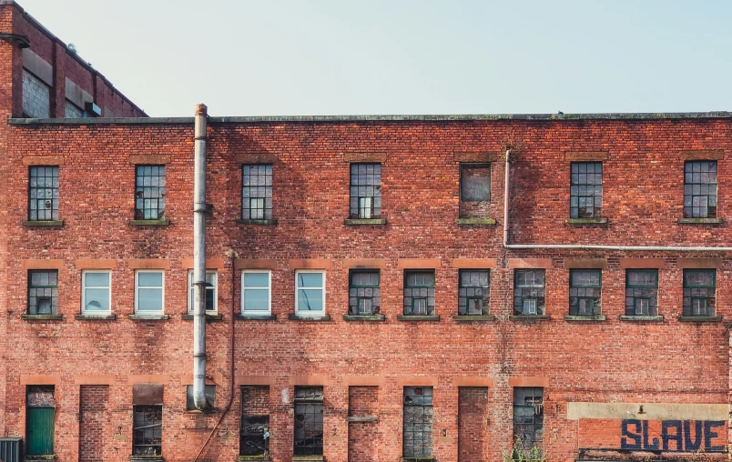 there is a large brick building that has three stories