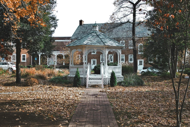 a small, white house with many windows in it