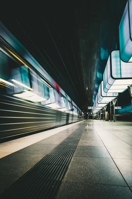 a train passes by in front of some people