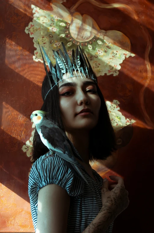 a woman wearing weird hair and a bird on her head