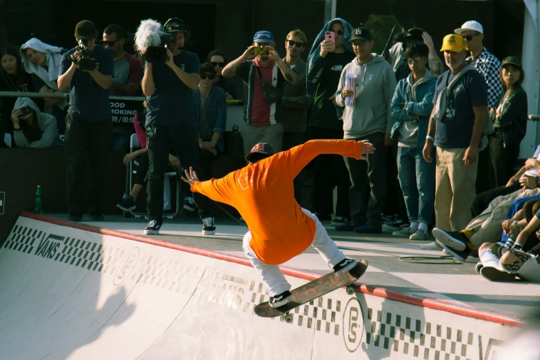 a man on a skateboard does a trick at a park