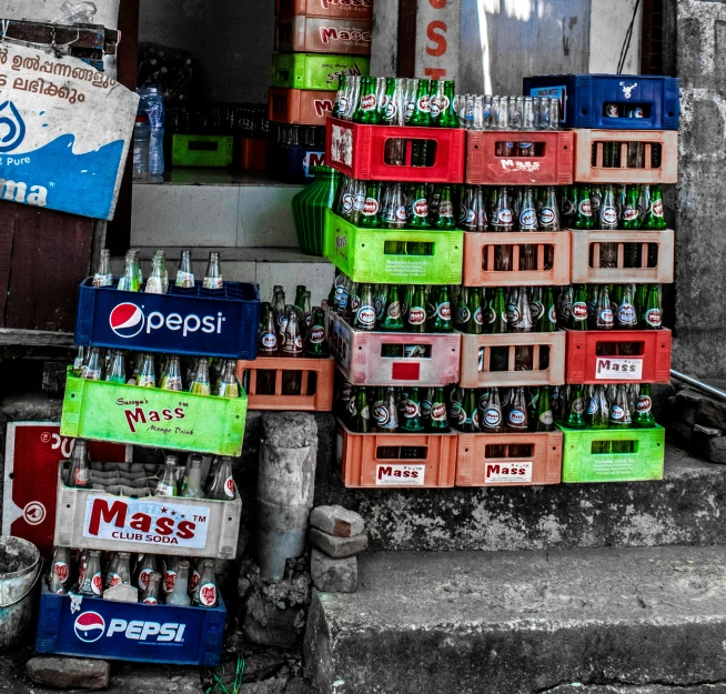 several boxes stacked on top of each other with different flavored beers