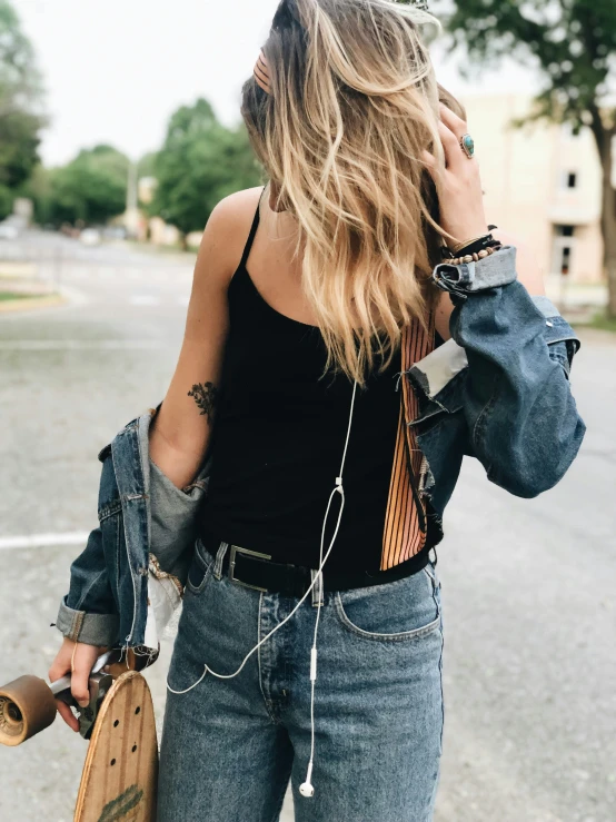 girl with handbag and headphones in the street