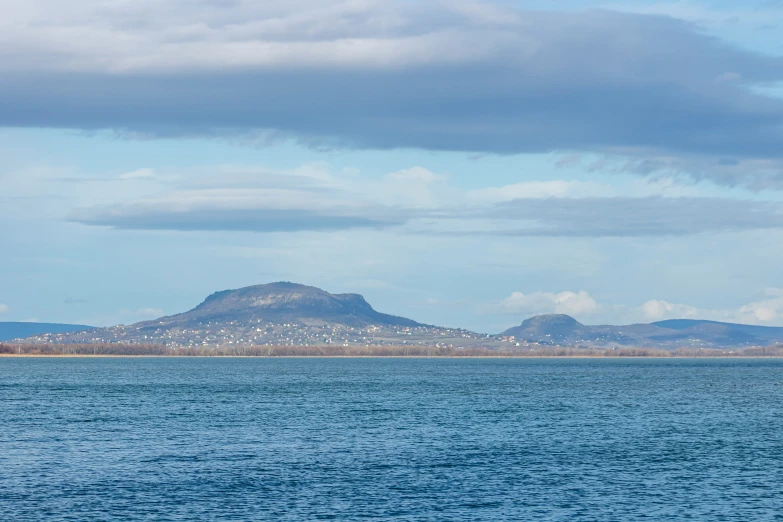 a group of mountains with lots of water around