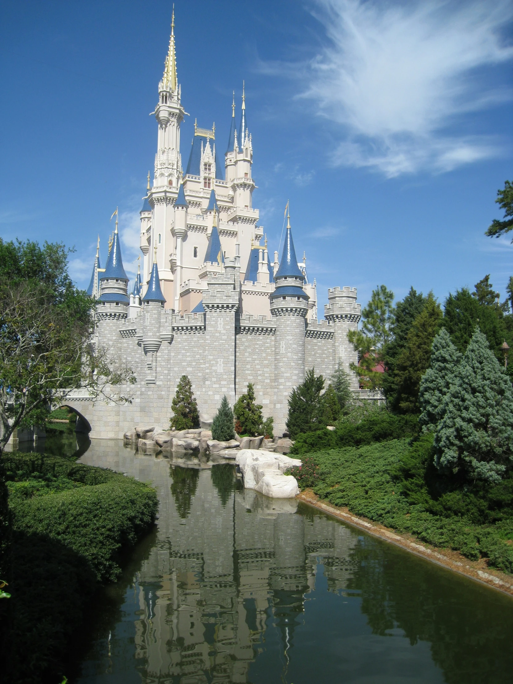 a large castle sitting next to a body of water