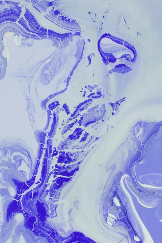 a swirl of blue and white in a liquid substance