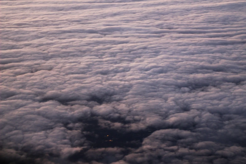 the sky is covered in thick white clouds