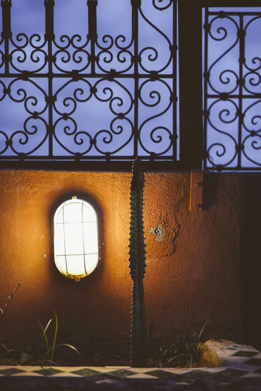 a window that has iron and metal bars over it