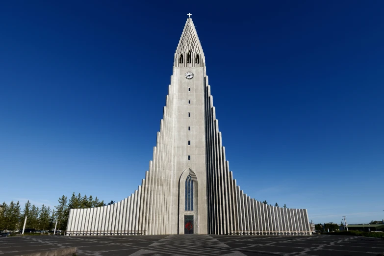 a tall church with a massive steeple and clock