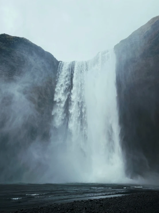 an image of water cascading up a mountain