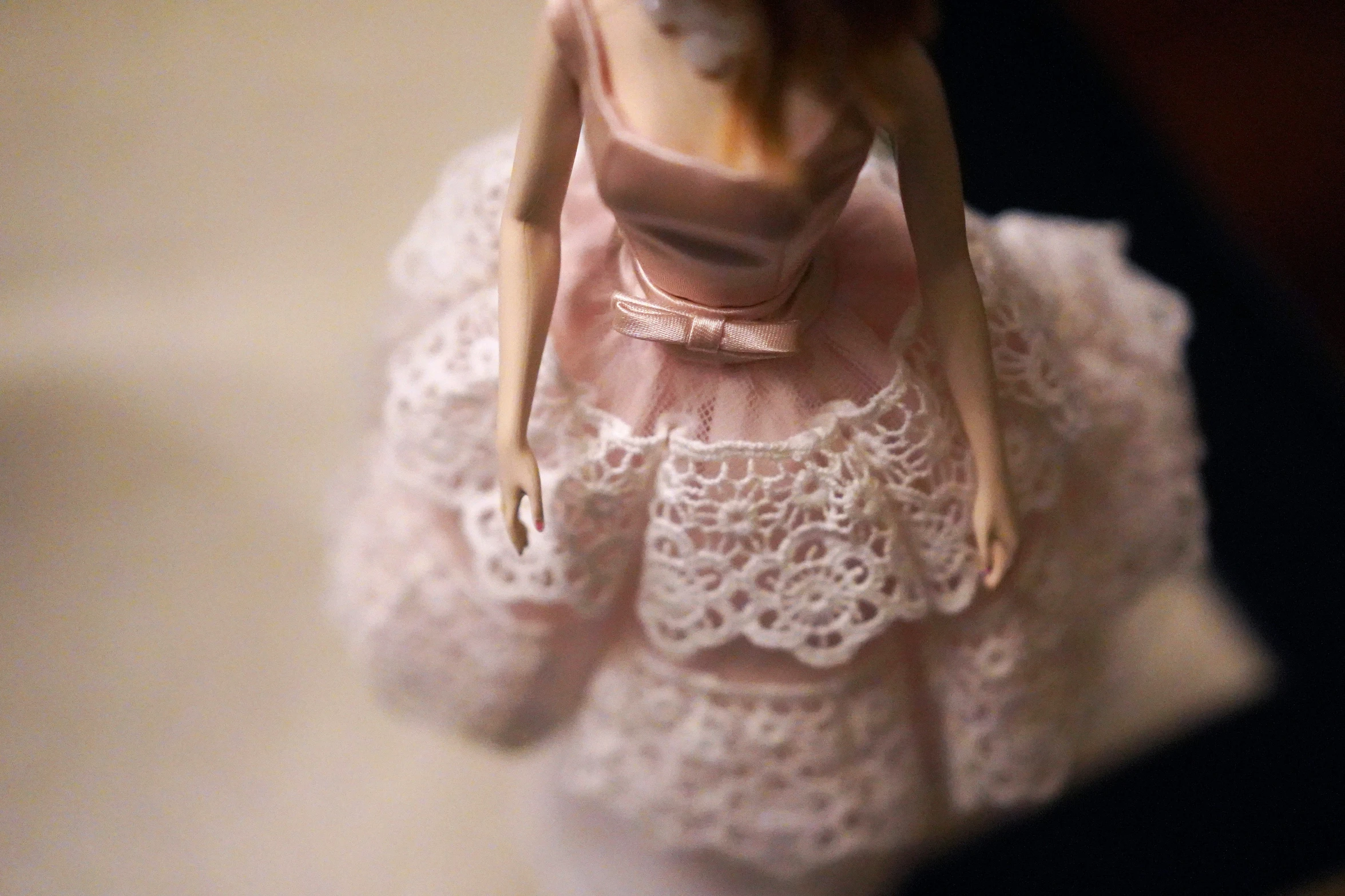 a close up view of a doll dressed in a dress