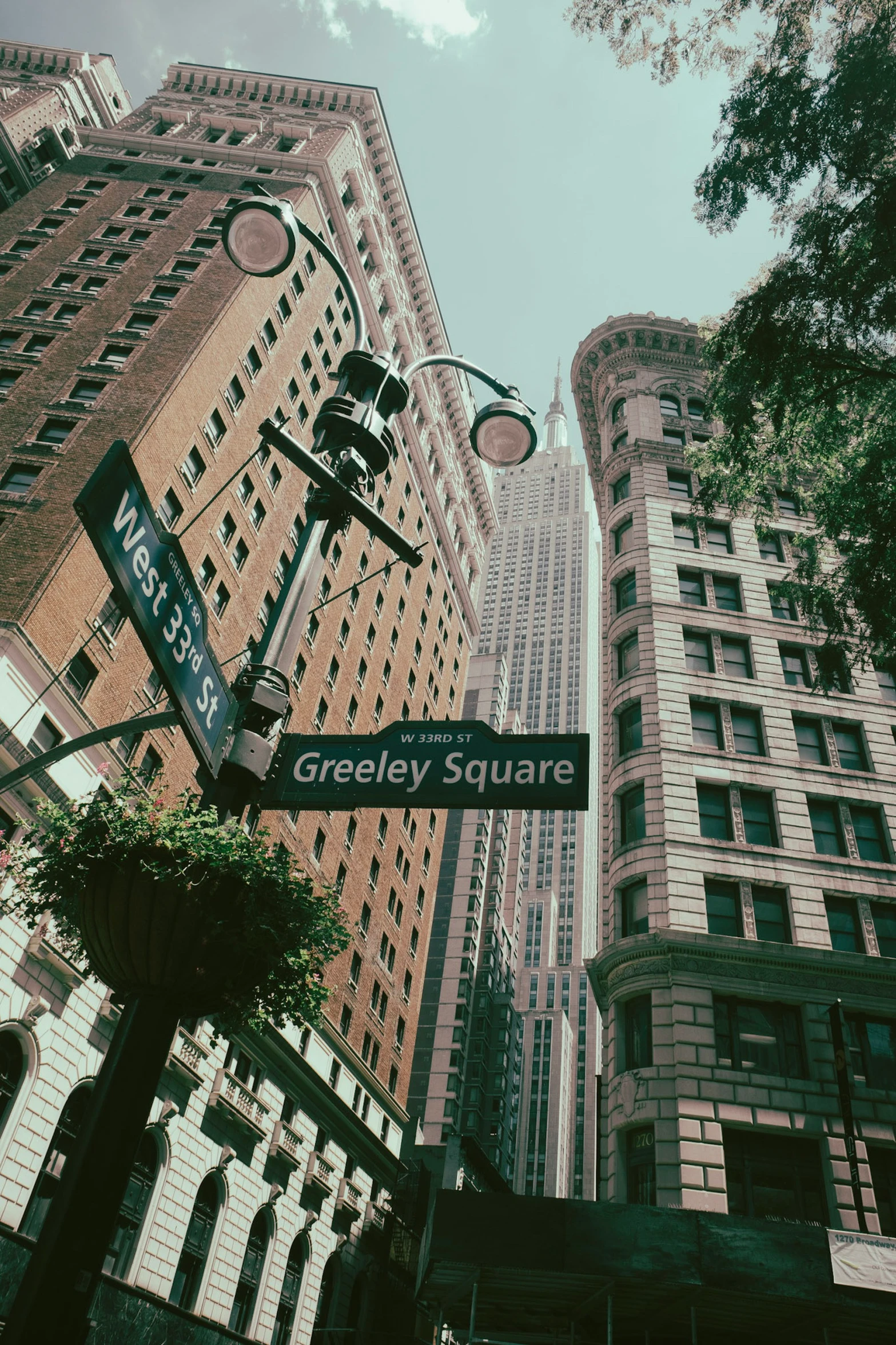 a sign for the corner of two streets on a post