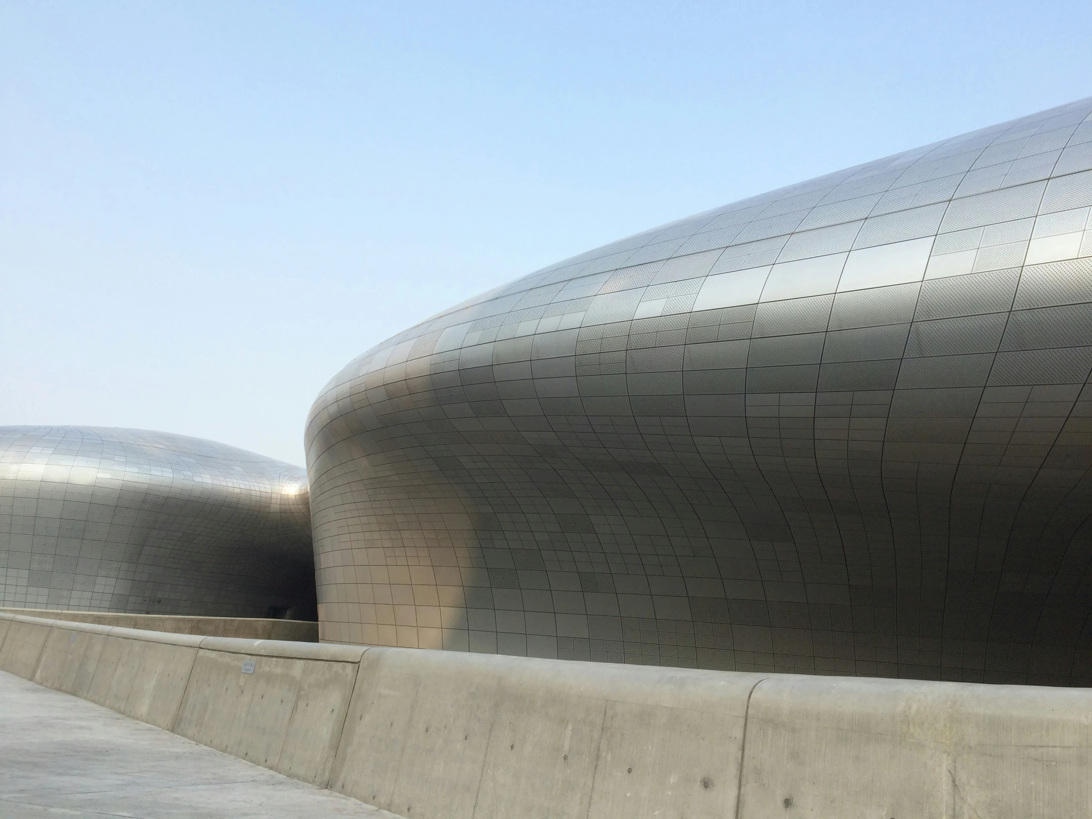 concrete walls of a building with curved lines