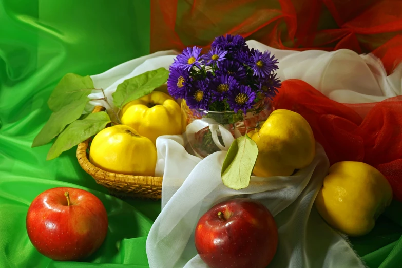 a basket that has some flowers in it and a vase with purple and yellow flowers