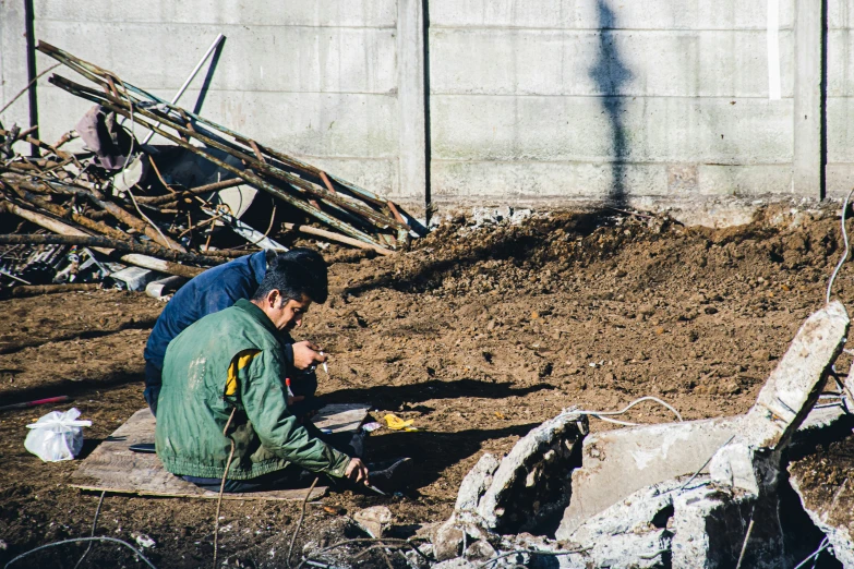 a person with a dog and dirt near a building