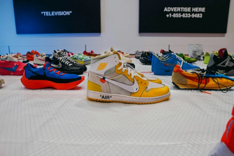 an array of sneakers in varying colors are shown