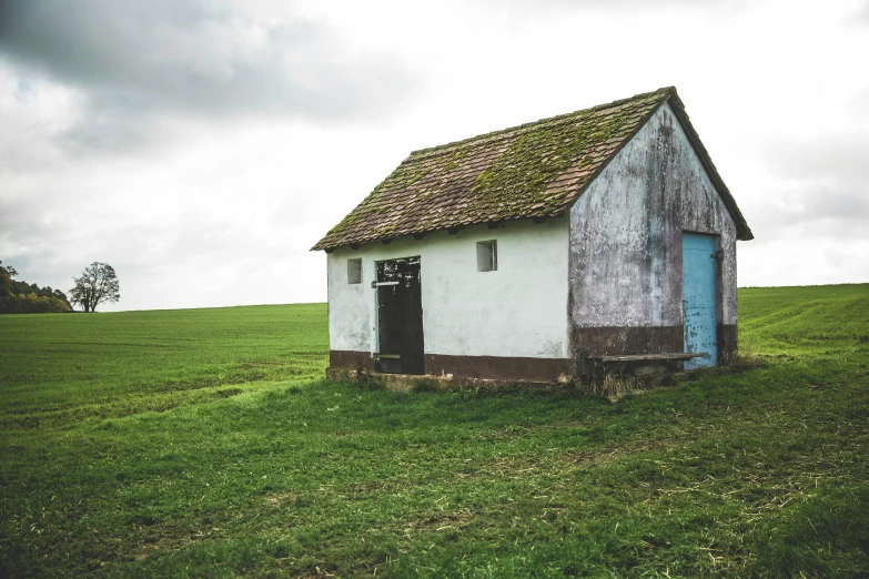 an old, abandoned house in the middle of nowhere