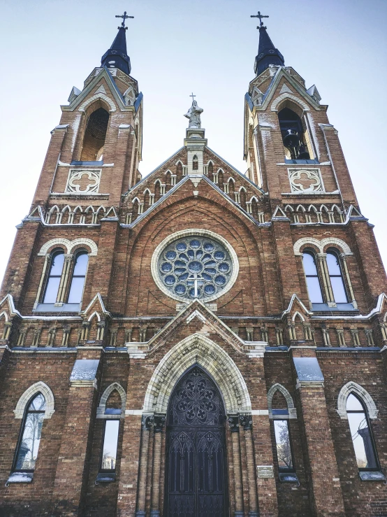 this cathedral has two towers that are connected by black wrought iron spires