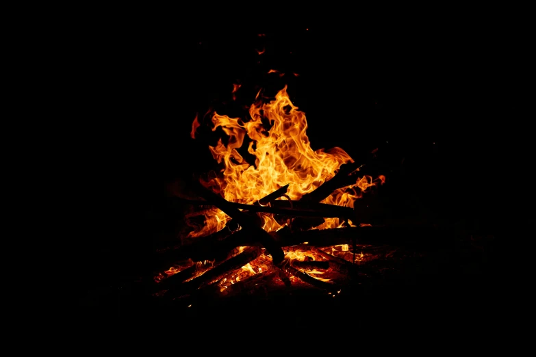 a fire burning in the dark with lots of flames