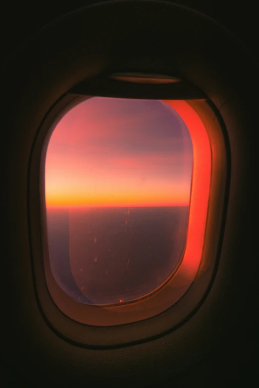 a window in a plane on a sunny day