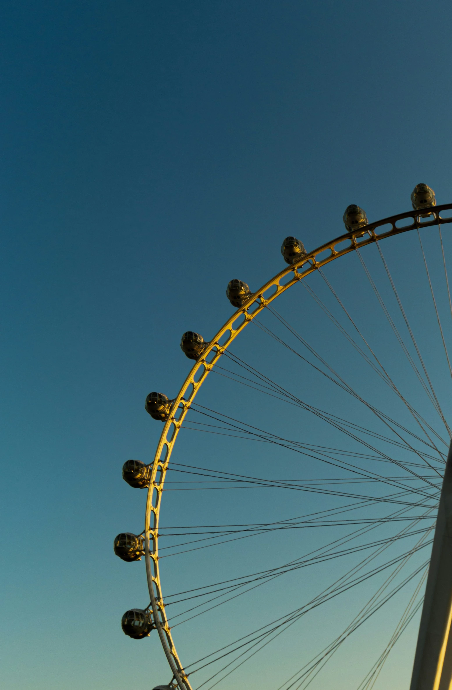 a view of a ferris wheel with bright lights