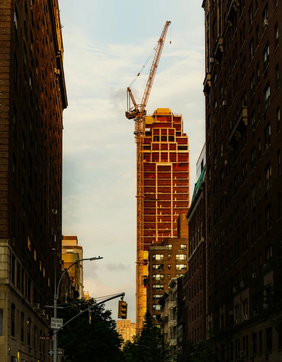 a crane working on the roof of a building