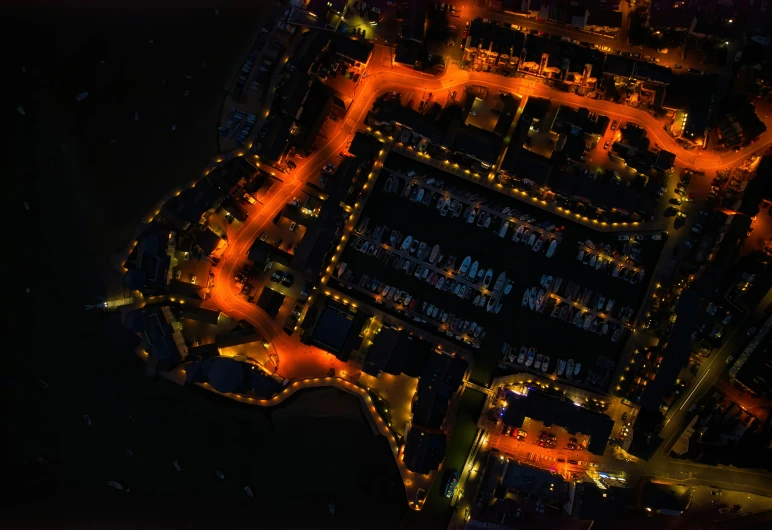 an aerial view of a city street intersection at night