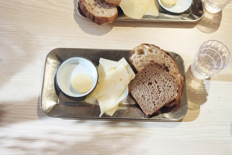 bread slices of cheese and a small bowl of er