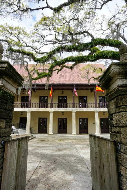 an entrance gate leading into a very large building