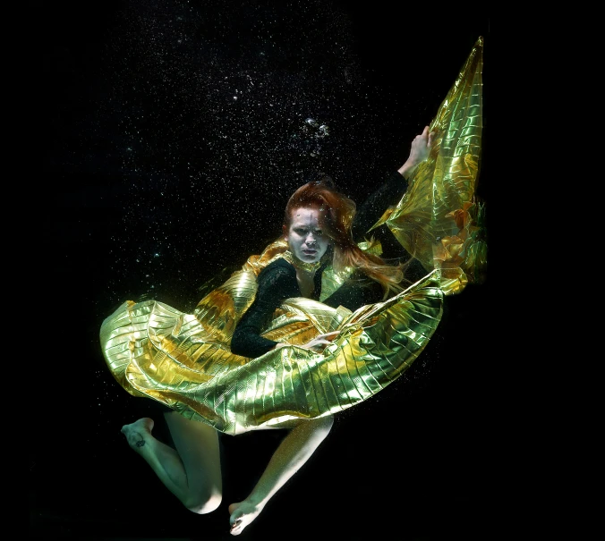 a woman underwater in an air like body suit