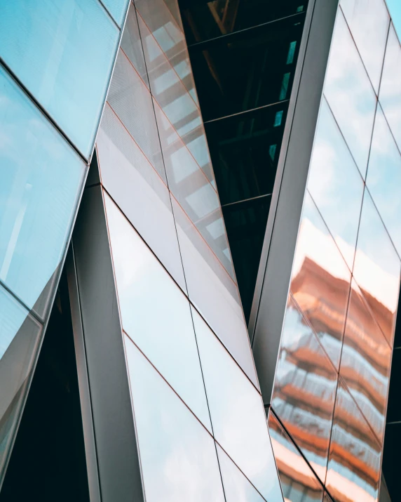 three skyscrs in front of a building with a sky background