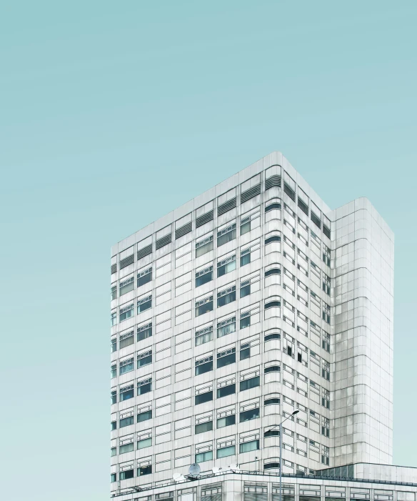 a large modern glass building on the corner