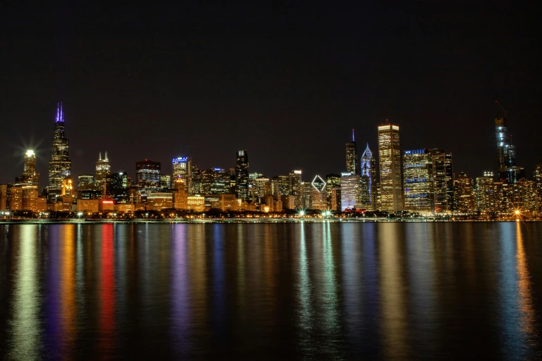 the skyline in new york city is reflecting in the water