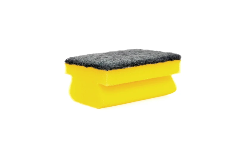 a sponge used for cleaning a white background