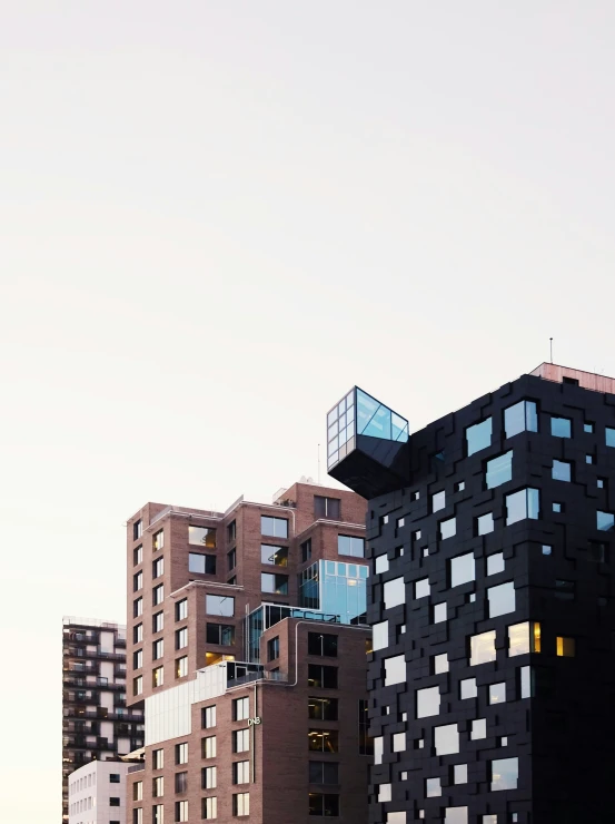 several black and white buildings on an urban street