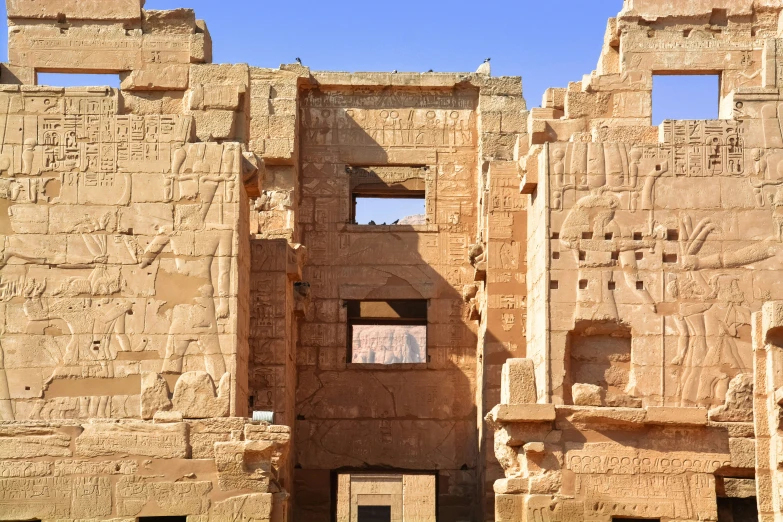 large, ornate ruins with carved faces and carvings