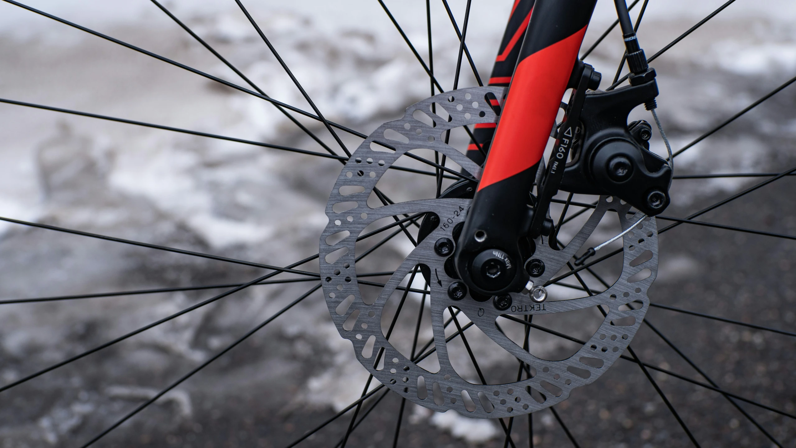 a close up image of the ke and front wheel of a bicycle