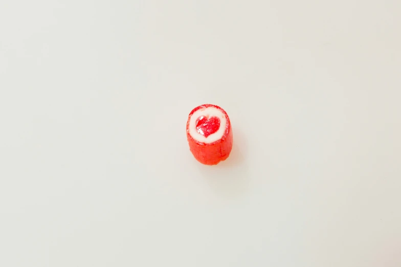 some type of candy with red filling sitting on the table