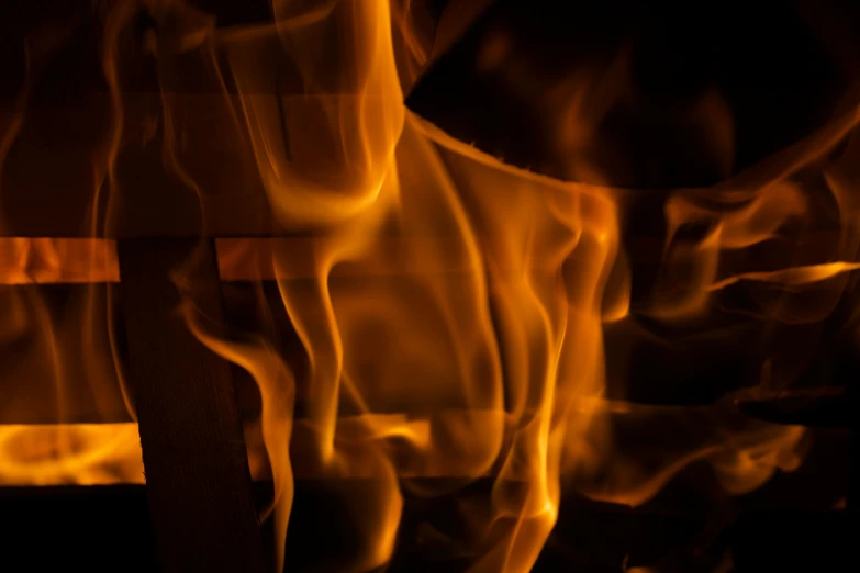 a closeup of a fire with yellow smoke